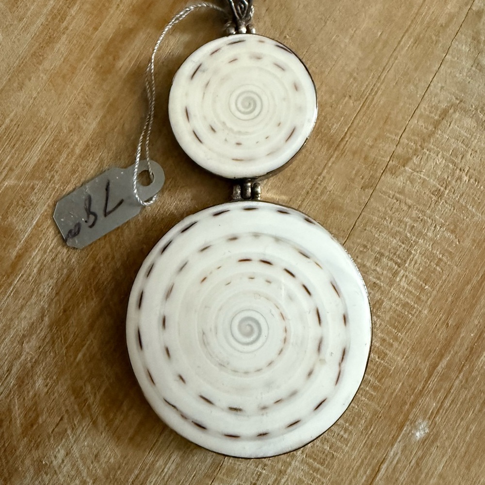 Shiva Shell White Spiral Pendant wrapped in sterling silver
